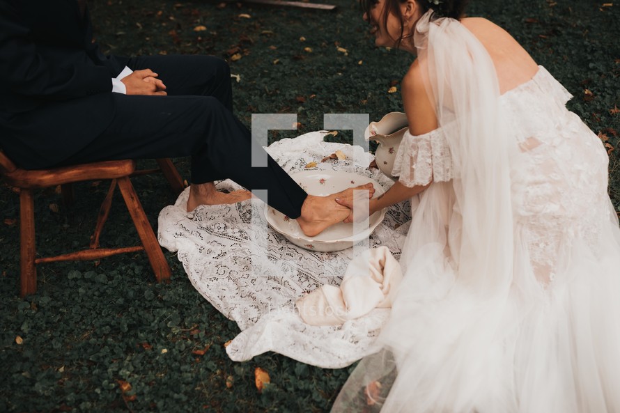foot washing during a wedding ceremony 