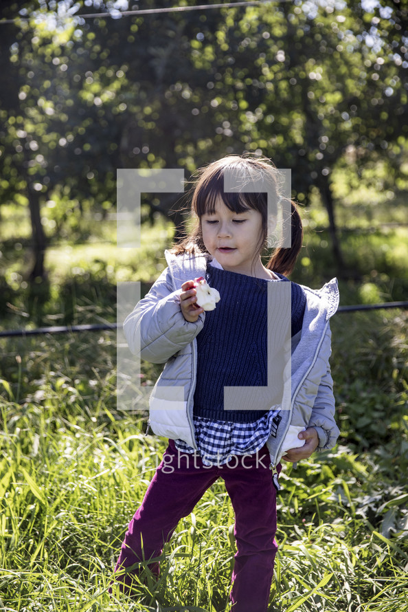 Little girl with an apple