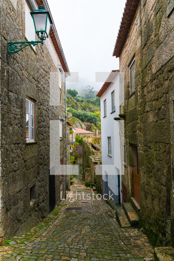 mossy cobblestone path - Old street in village of Monsanto, Portugal
