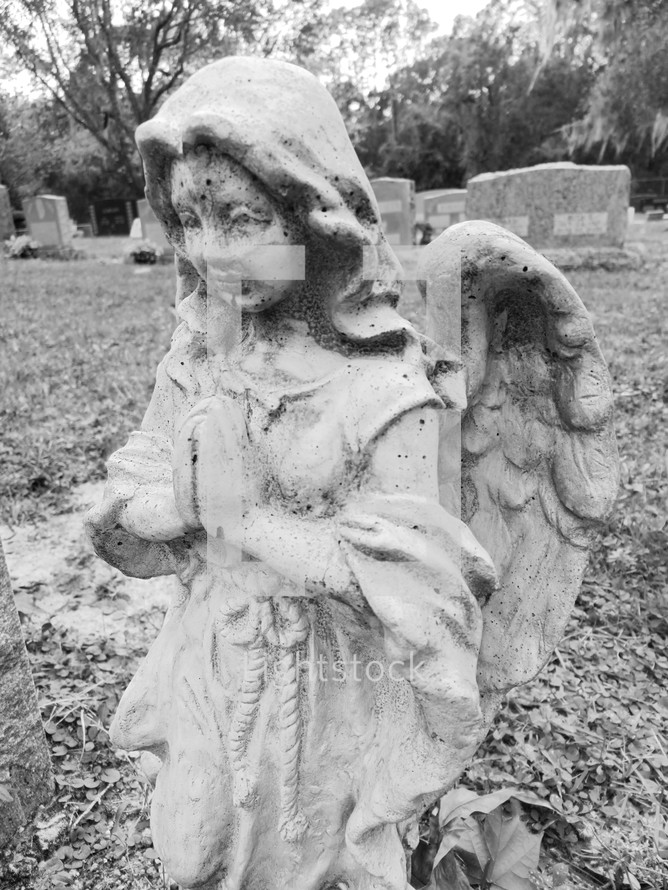 Angel statue in a graveyard - Black and white