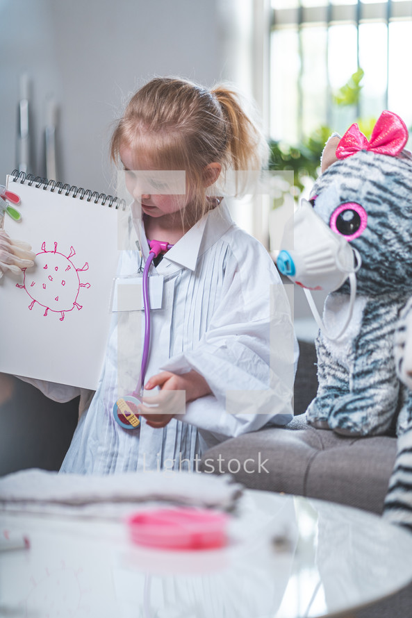 little girl playing doctor 