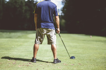 a man on the golf course 