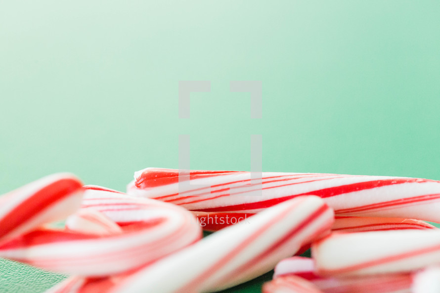 candy canes on a green background 