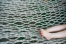 child's toes on a hammock 