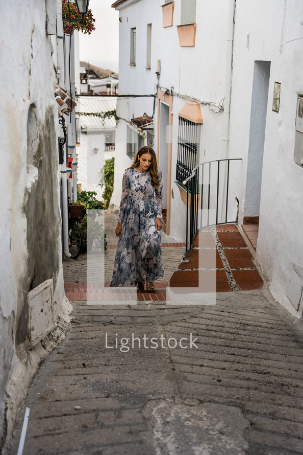 Woman in dress on the stairs 