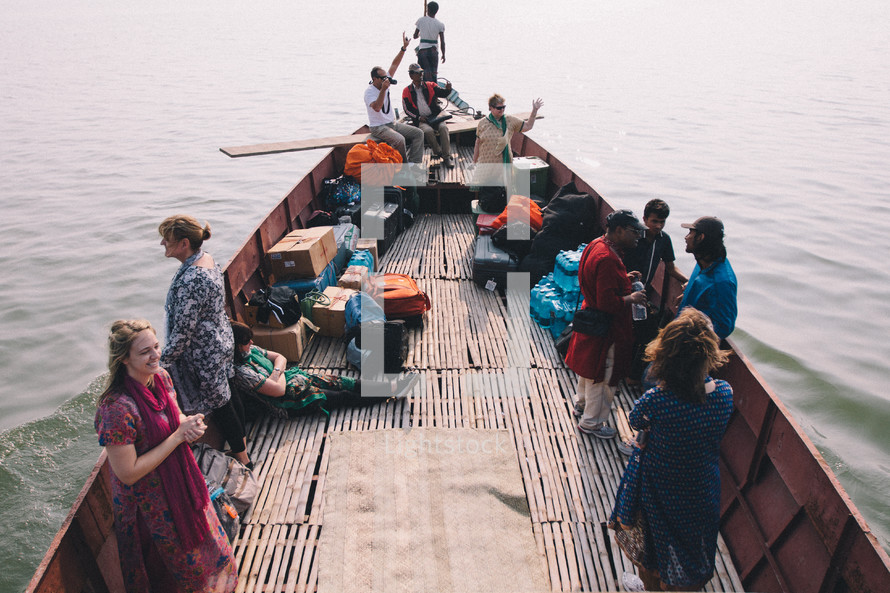 people traveling on a ferry boat 