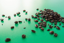 coffee beans on green 