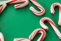 candy canes on green background 
