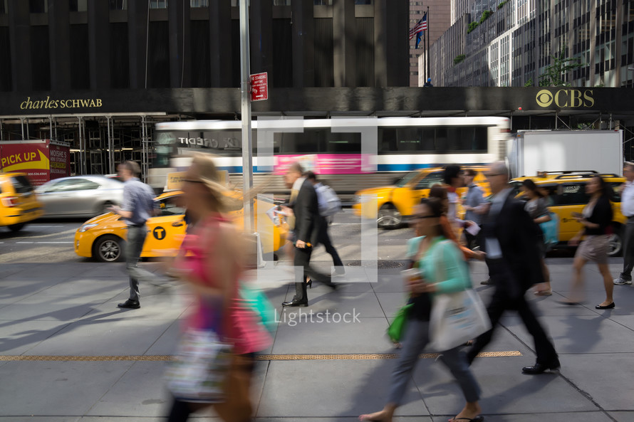 pedestrians in motion on a busy city sidewalk 
