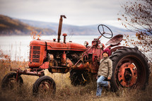 a little boy with a tractor 