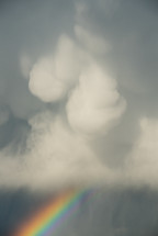 rainbow under storm clouds 