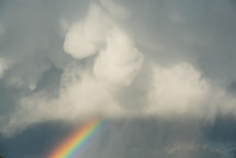 rainbow under storm clouds 