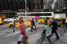 pedestrians in motion on a busy city sidewalk 