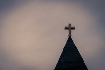 Church steeple roof with golden cross