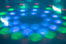 ring of lights on roller skating rink floor