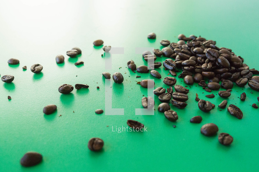coffee beans on green 