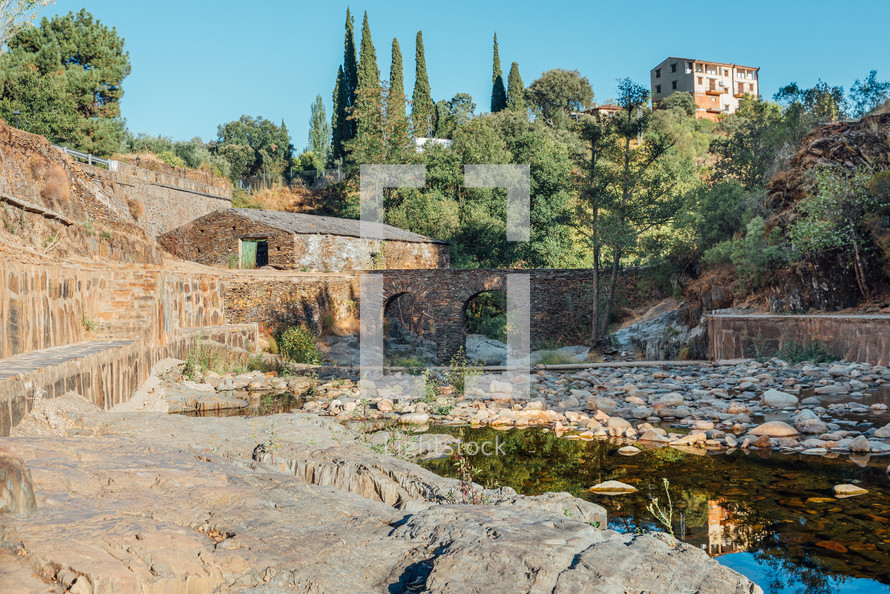 Roman bridge and natural pool in Las Mestas, Caceres, Extremadura, Spain