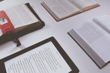 tablets and open Bibles on a table for a Bible study 