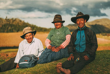 people sitting on a hill in Peru 