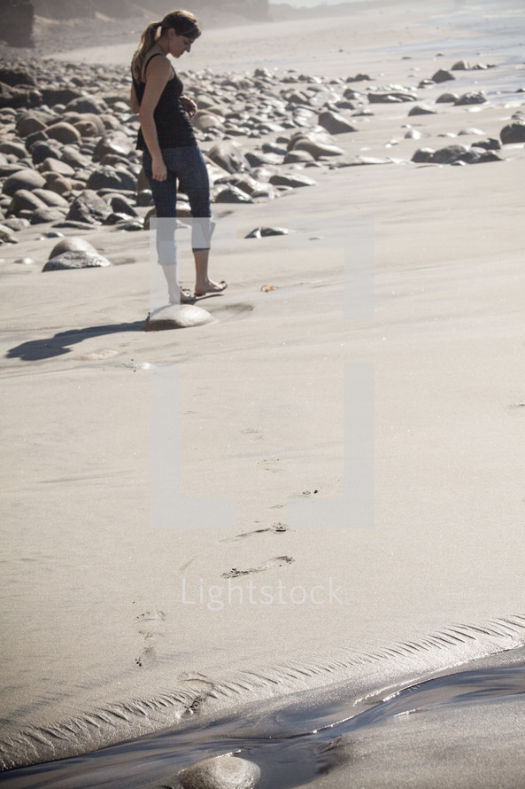woman walking on a beach 