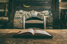 open Bible on a table in a cabin 