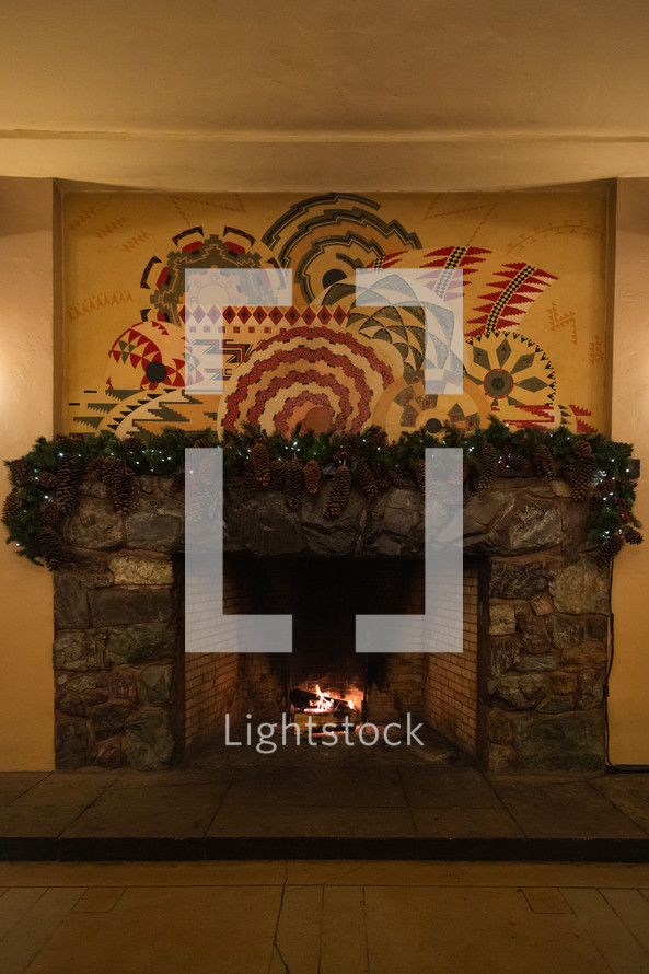 Decorative mantle over large stone fireplace