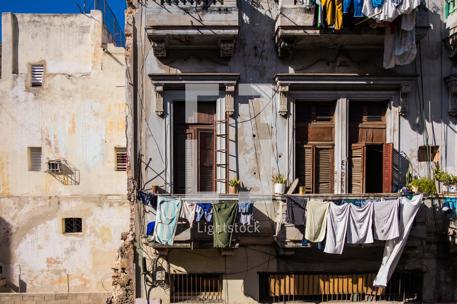 clothes hanging on a clothesline off a balcony in Havana, Cuba 