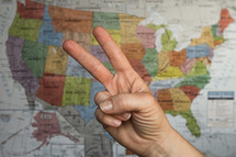 peace sign in front of a map of the United States 