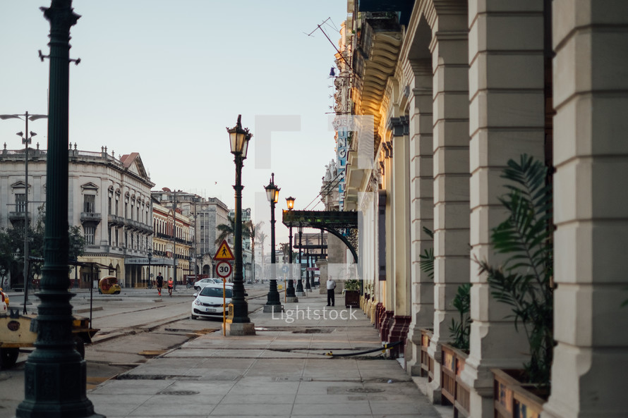 street lamps, sidewalks, and downtown buildings in Havana, Cuba 