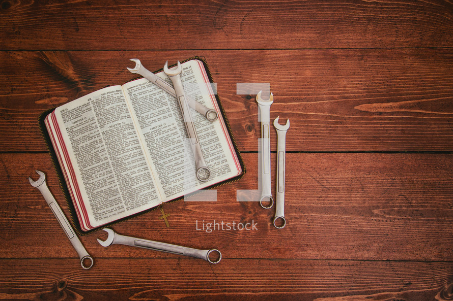 wrenches on a Bible
