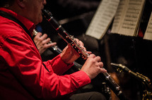 man playing a clarinet 