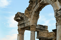 ancient columns and arch in ruins in Ephesus, Turkey