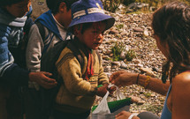 children waiting in line in Peru 
