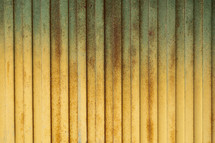 	Background of yellow metal door in grungy style
