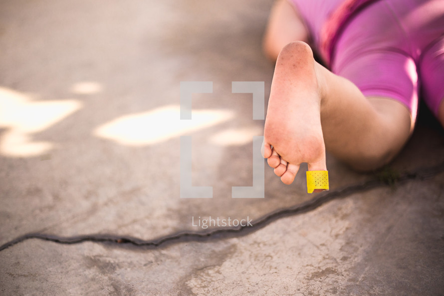 bandaide on a child's toe 