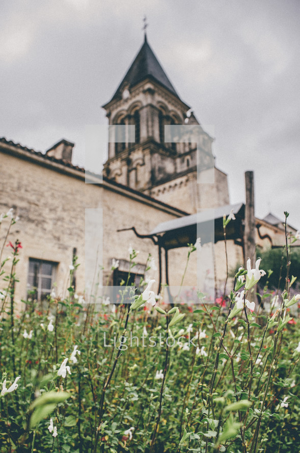 flowers in front of a church 