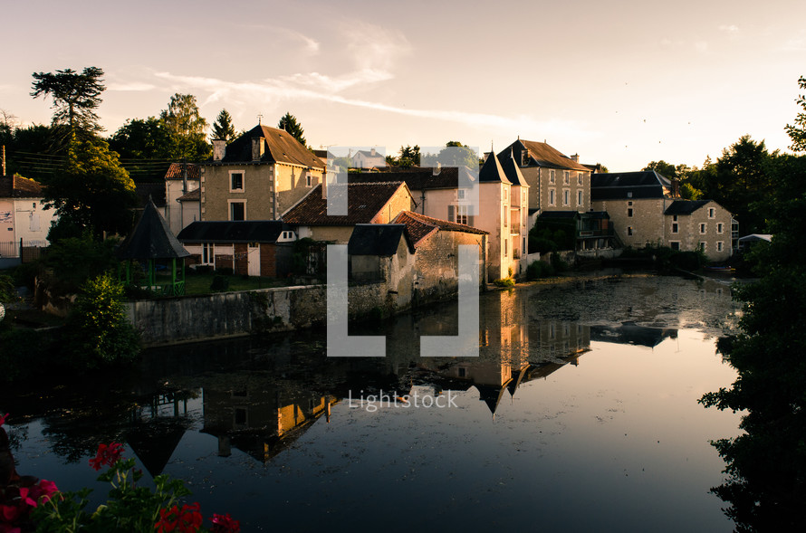 homes on a channel at sunset in France 