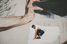 a man jumping and street art 