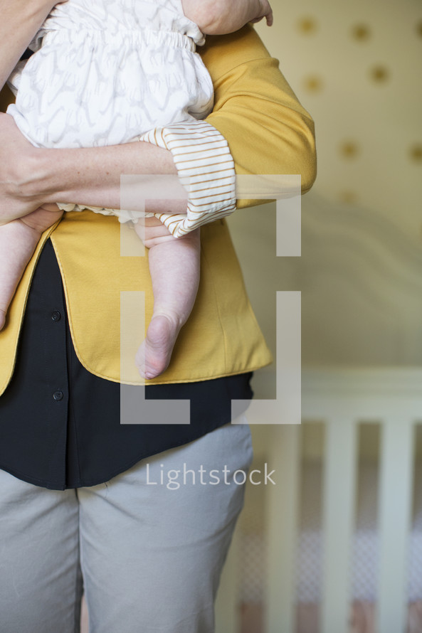 mother holding her infant 
