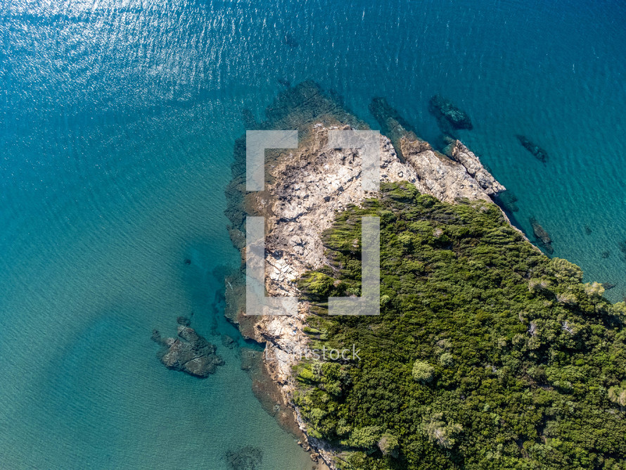 aerial view over an island shore 