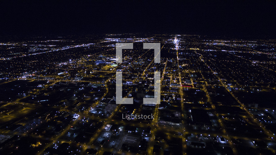 ariel view of lights from city blocks at night.