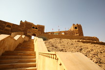 fortress walls and stairs in a desert 