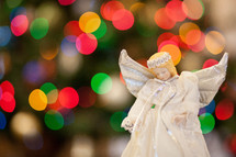 angel ornament and bokeh Christmas lights 