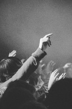 raised hands at a conference worship service 