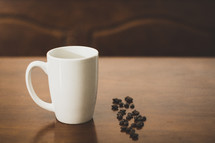 coffee mug and coffee beans
