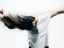 young woman flipping her hair 