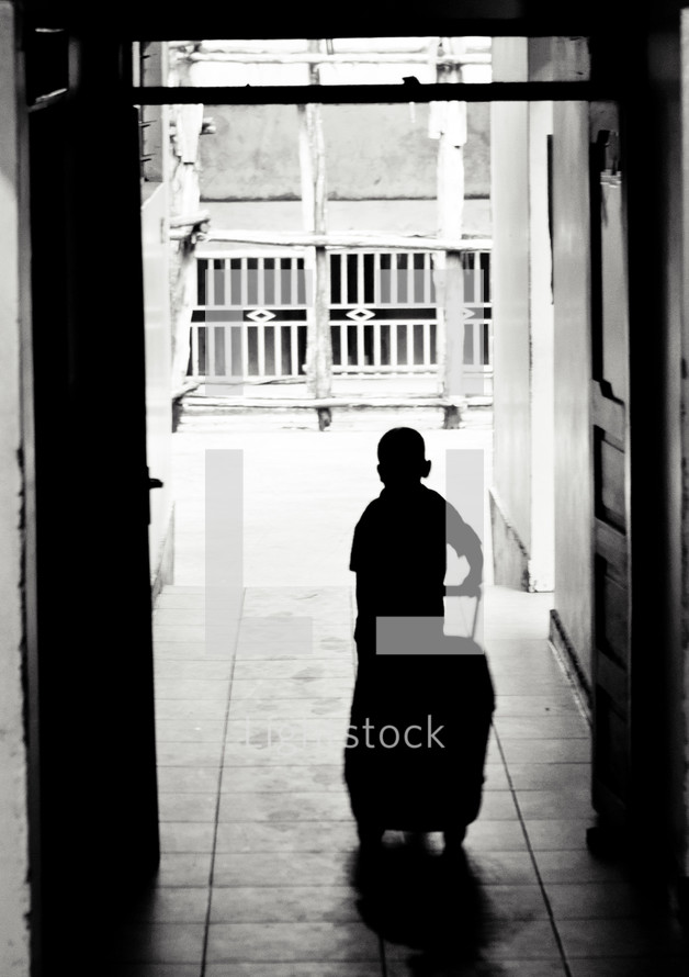 silhouette of a boy child with a suitcase