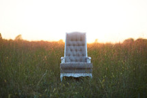 empty chair in a field 