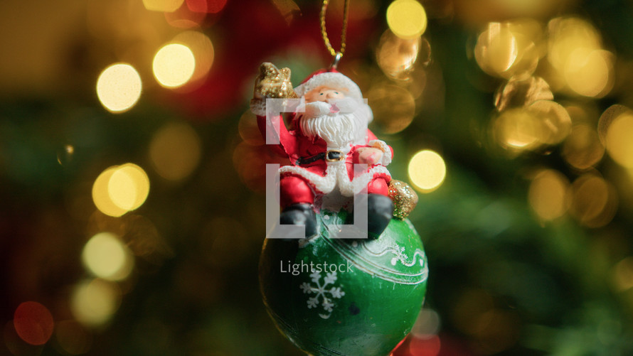 Santa Claus on Decoration Ball for Christmas celebration 