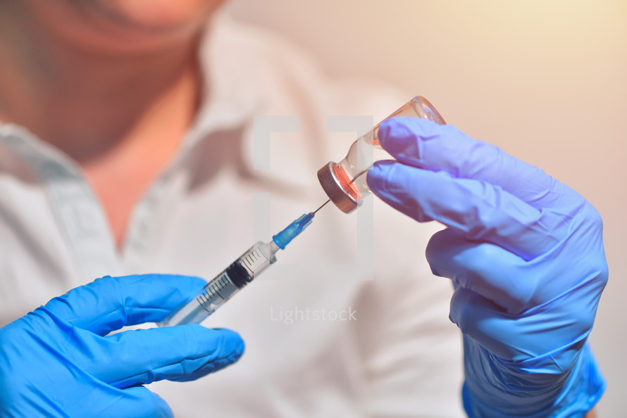 vaccine bottle with syringe and needle for immunization 